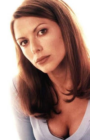 Kari Wuhrer as 