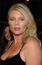 Peta Wilson as 