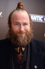 Paul Kaye as 
