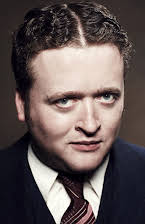 Neil Casey as 