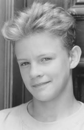 Simon Fenton as 