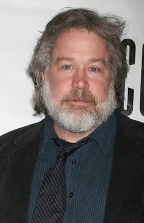 Tom Hulce as 