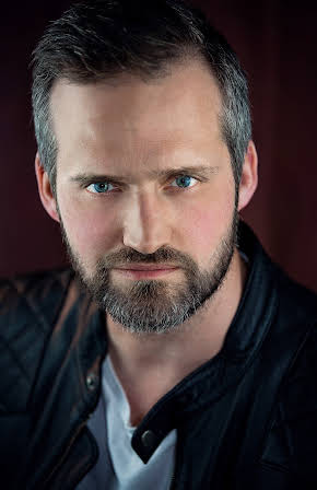 David Izatt as Director