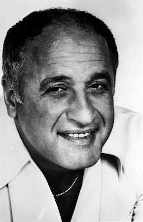 Vic Tayback as 