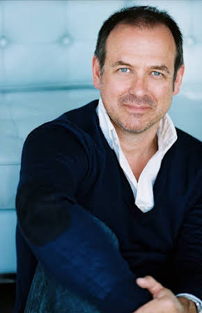 Ian James Corlett as 