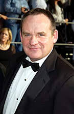 Paul Guilfoyle como 