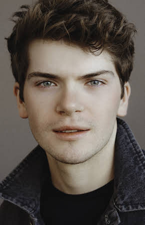 Colton Ryan as 