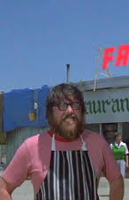 James McCausland som Director