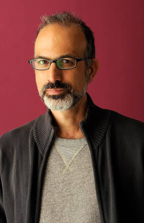 Arnon Goldfinger as Director