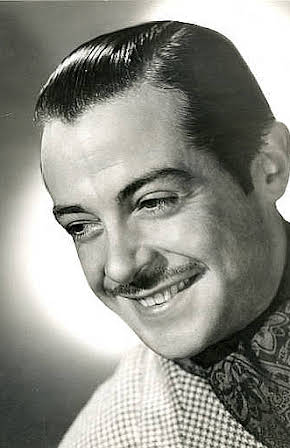 Fernand Gravey as 