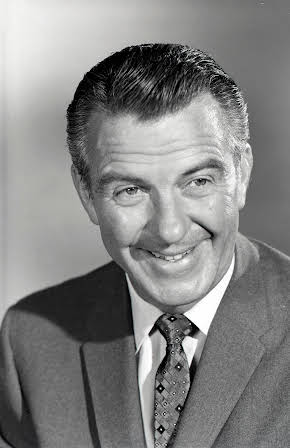 Hugh Beaumont as Director