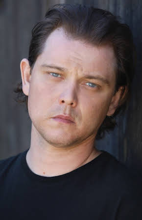 J. Michael Trautmann as 