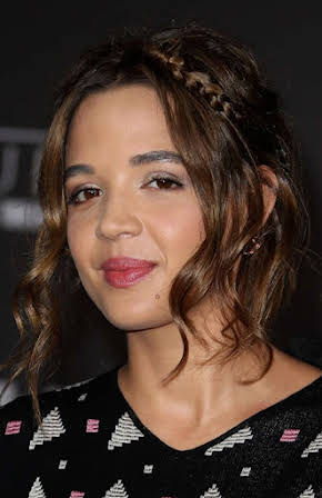 Georgie Flores as 
