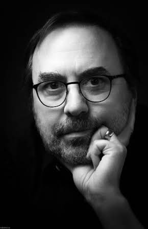 Sylvain Guy as Director