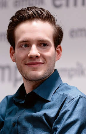 Adrian Zaremba as 