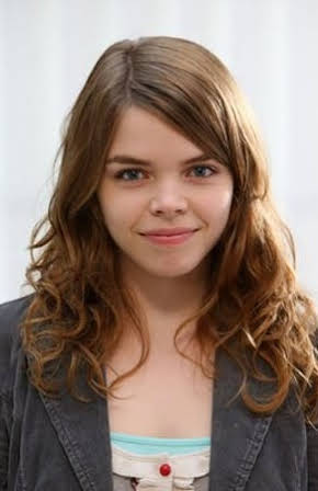 Jo Woodcock as 