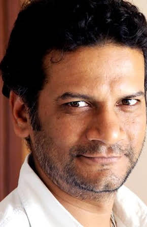 Satish Rajwade as Director