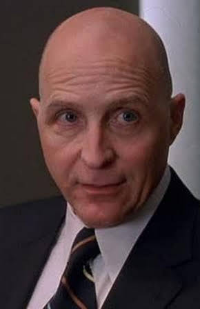 Gerry Becker as 