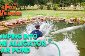 The Fish Whisperer: Jumping into the Alligator Gar Pond!