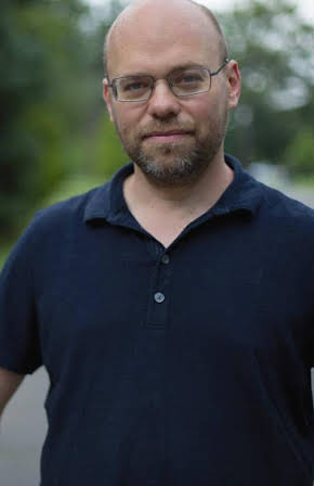 Adam Davidson as 