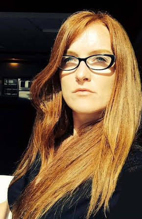 Elaine Bogan as Director