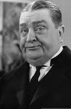 Robert Greig as Director