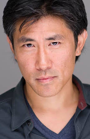 Jinn S. Kim as Man on Fire Escape