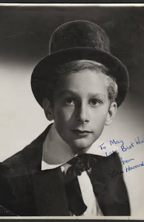 John Howard Davies as Director