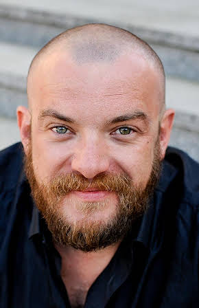 Lukasz Palkowski as Director