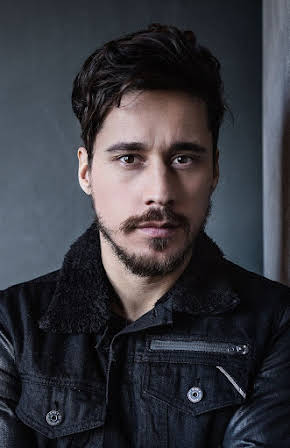 Peter Gadiot as 