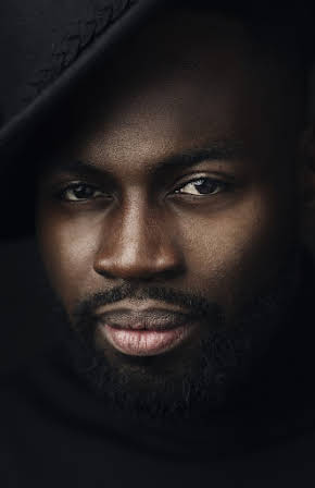 David Nzinga as Mima Host