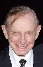 John Paxton como Mr. Schmitt