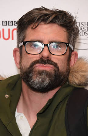 Dan Renton Skinner as 