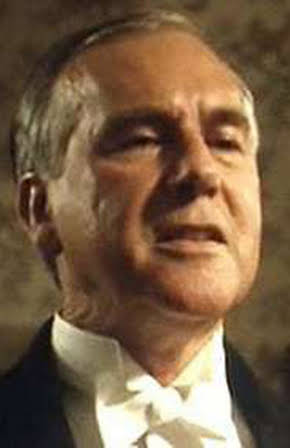 Neville Phillips as Minister