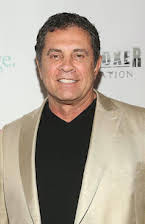 Dimitri Logothetis som Director