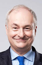 Paul Gambaccini as 