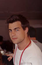 Derick Martini as Director