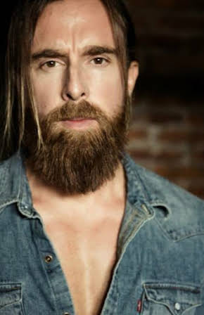 Phill Webster as 