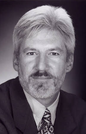 Tom Dugan as 
