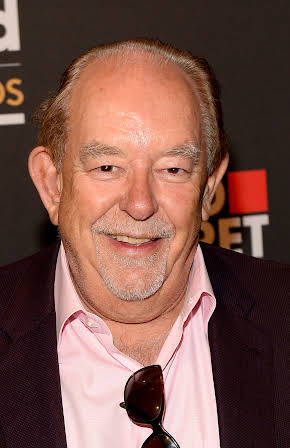 Robin Leach as 