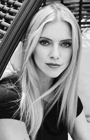 Elle Evans as 