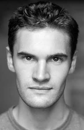 Tom Bateman as 