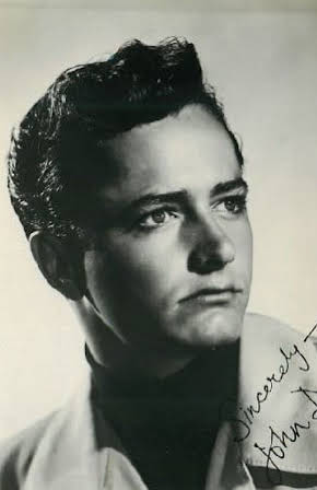John Derek as 
