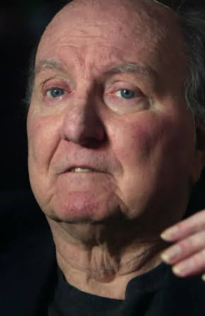 Wayne Barrett as 