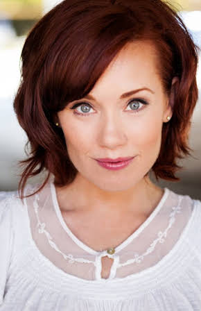 Paula Rhodes as 