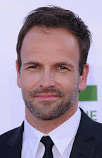 Jonny Lee Miller as 