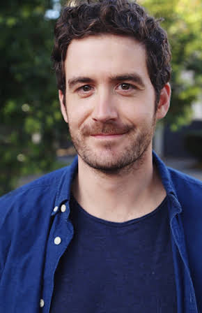 Sam Cotton as Tabloid Reporter