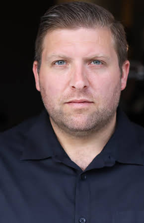 Andy Nez as Booth Guy