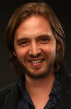 Aaron Stanford as 