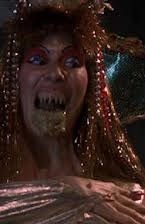 Tanya Papanicolas as Desert Siren No. 2 /  
            Human Hocker /  
            Woman Driver